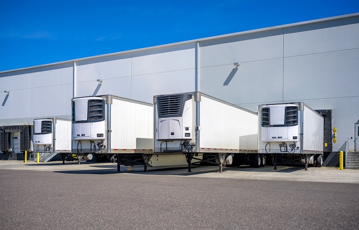 Reefer trailers at a refrigerated warehouse dock