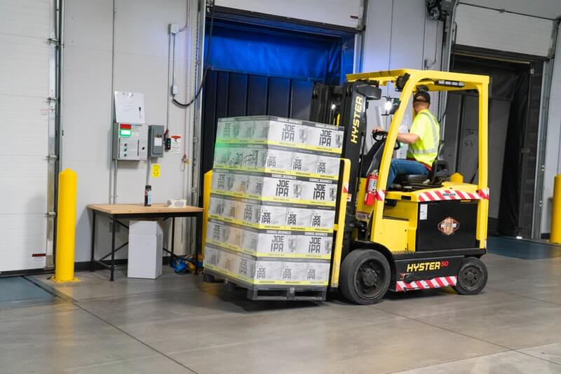 Forklift moving pallets for final mile delivery